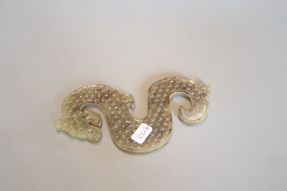 A Chinese green jade dragon plaque, Eastern Zhou style